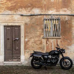 Motorcycle in front of house